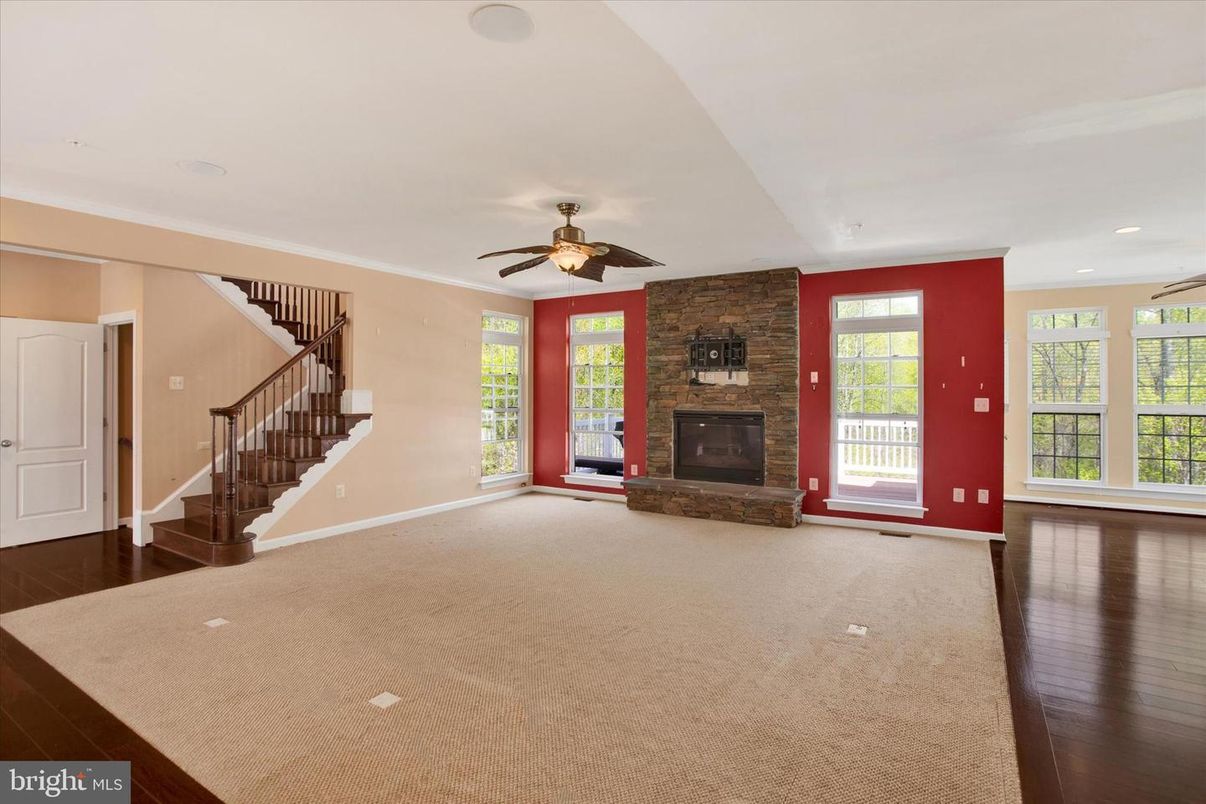 Empty room, Fireplace, Interior, Recessed Lighting, Stone Walls, Wood Texture Flooring