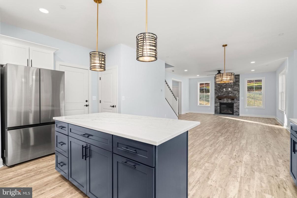 Fireplace, Interior, Kitchen, Pendant Lights, Recessed Lighting, Stainless Steel Appliances, Wood Texture Flooring