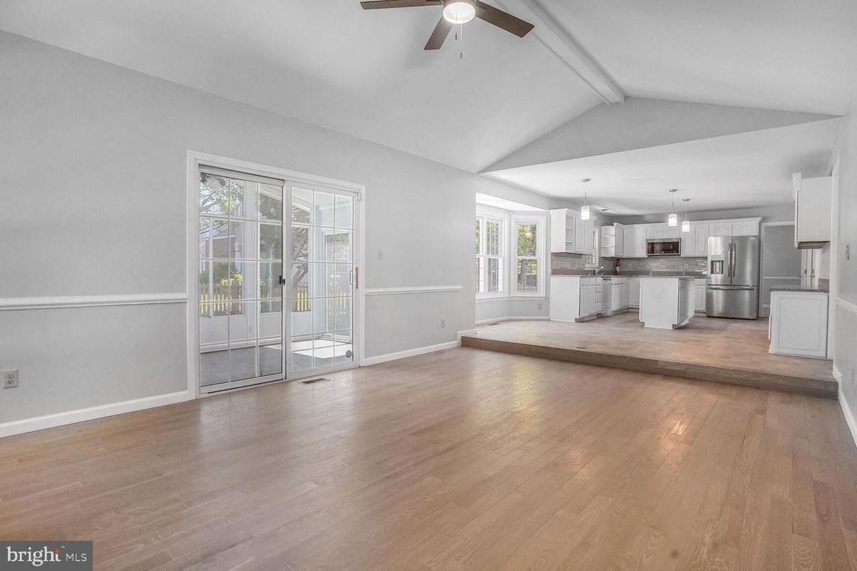 Empty room, Interior, Kitchen, Pendant Lights, Stainless Steel Appliances, Wood Texture Flooring