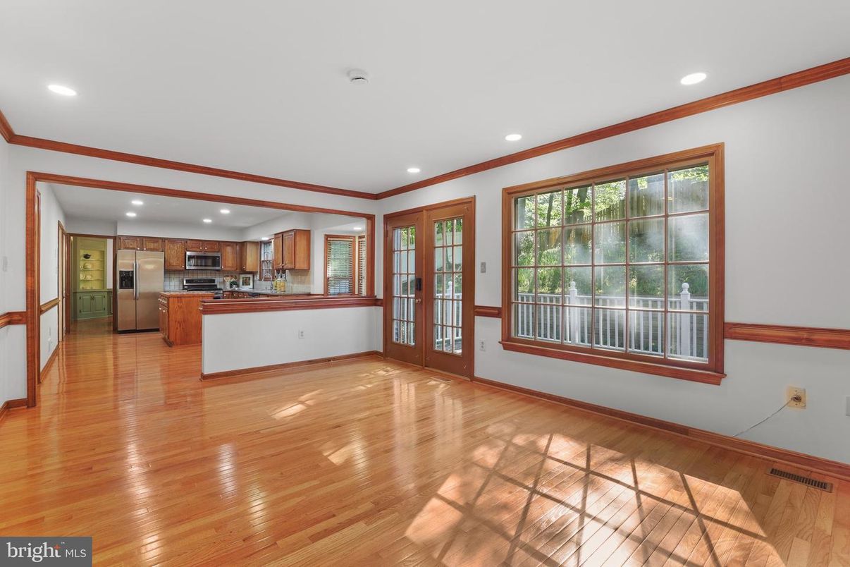 Empty room, Interior, Kitchen, Recessed Lighting, Stainless Steel Appliances, Wood Texture Flooring