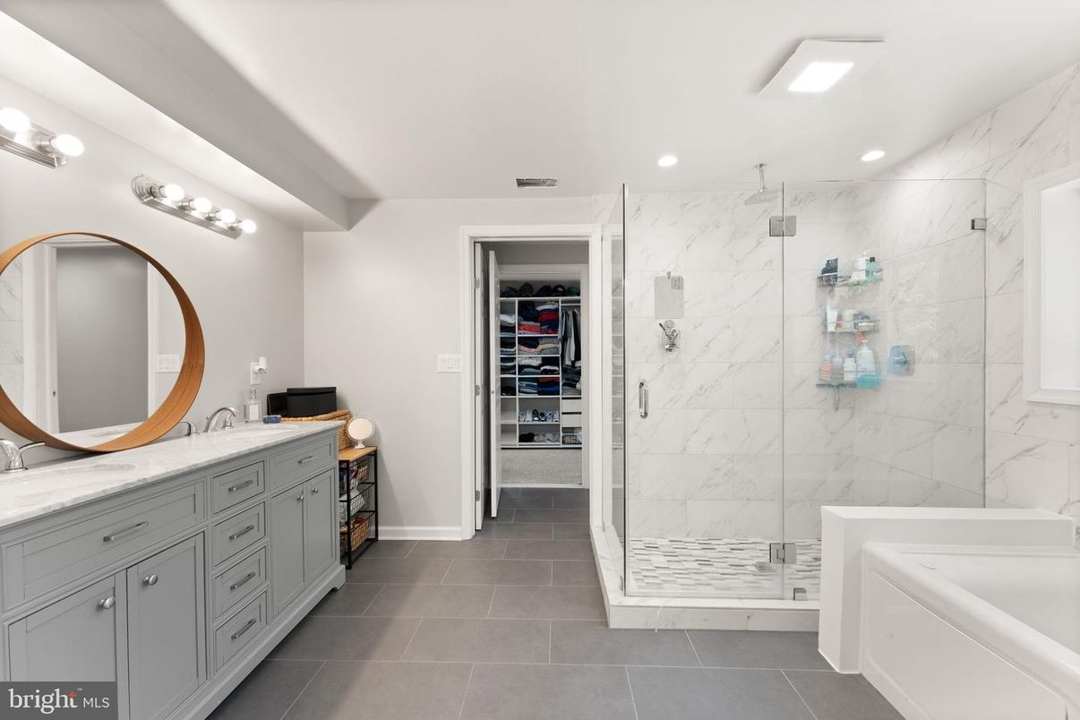 Bathroom, Dual Sink Vanities, Glass Shower, Interior, Marble Walls, Recessed Lighting, Walk-in Closets