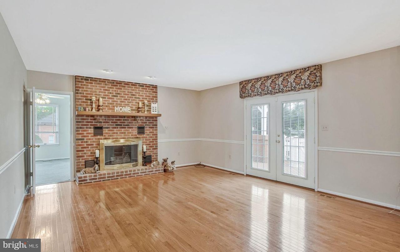 Empty room, Fireplace, Interior, Recessed Lighting, Stone Walls, Wood Texture Flooring