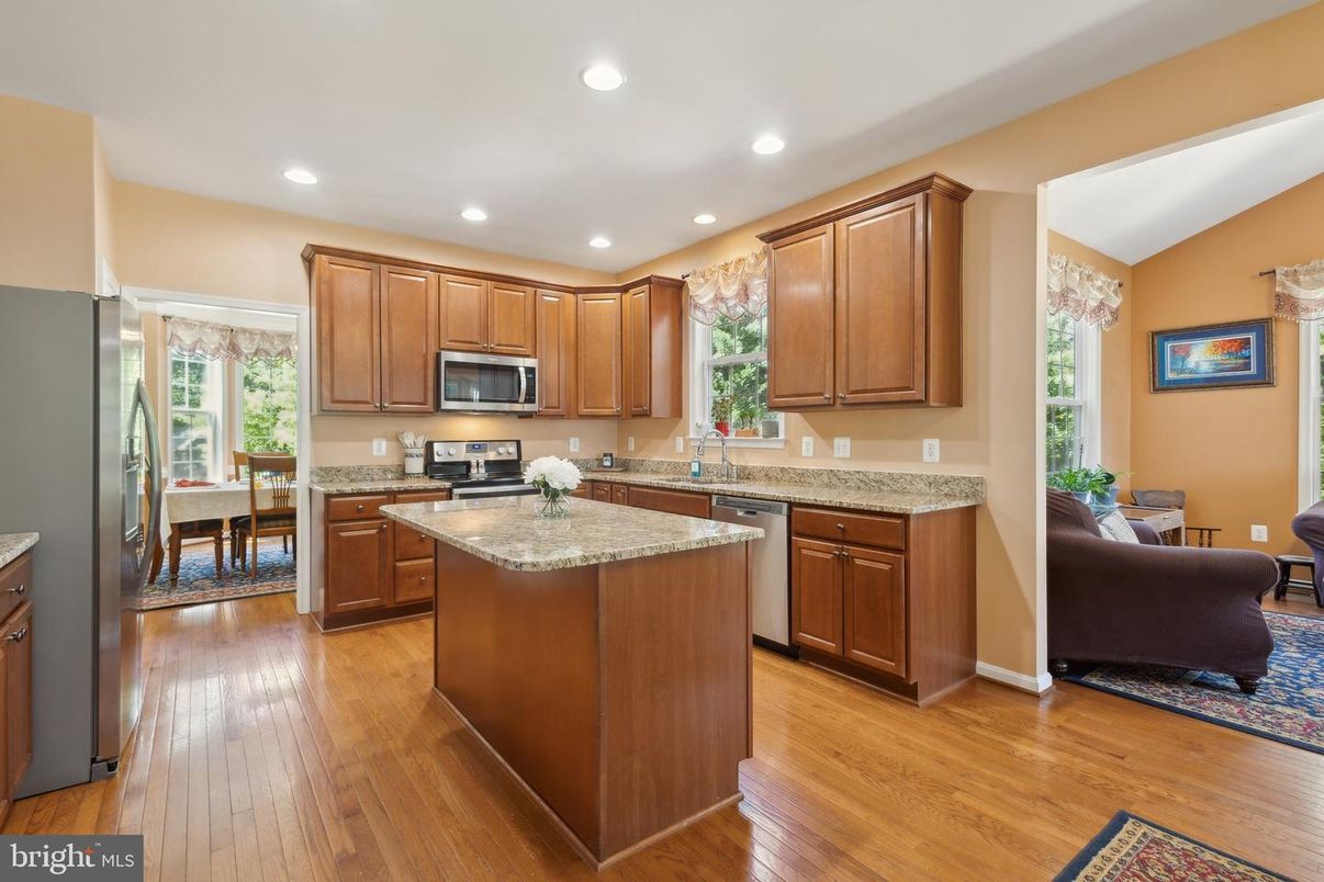 Chandelier, Dining room, Interior, Kitchen, Recessed Lighting, Stainless Steel Appliances, Wood Texture Flooring