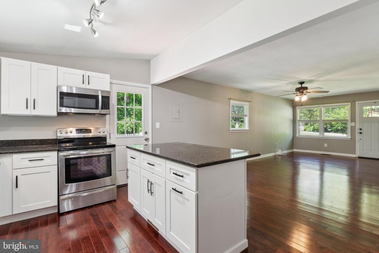 Empty room, Interior, Kitchen, Stainless Steel Appliances, Wood Texture Flooring