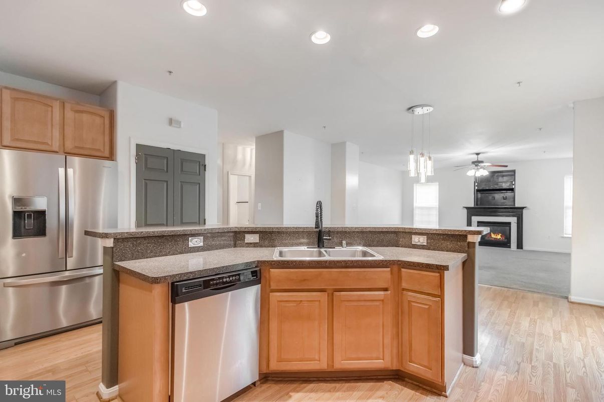 Fireplace, Interior, Kitchen, Pendant Lights, Recessed Lighting, Stainless Steel Appliances, Wood Texture Flooring