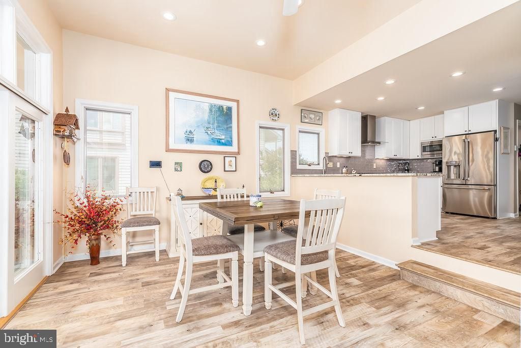 Dining room, Interior, Kitchen, Recessed Lighting, Stainless Steel Appliances, Wood Texture Flooring