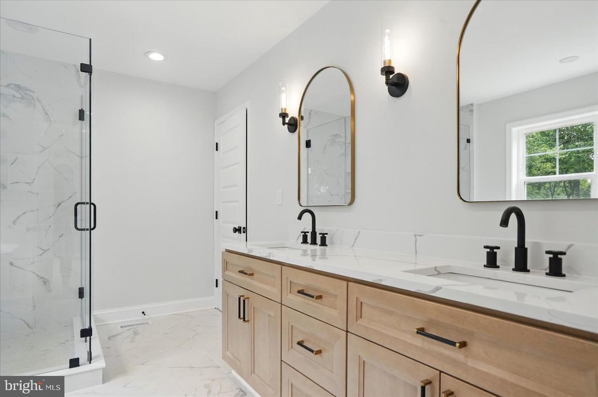 Bathroom, Dual Sink Vanities, Glass Shower, Interior, Marble, Marble Walls, Recessed Lighting