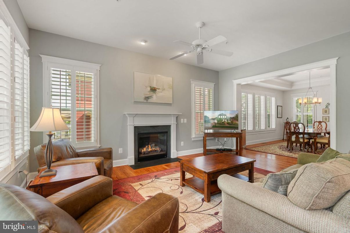 Chandelier, Dining room, Fireplace, Interior, Living room, Pendant Lights, Recessed Lighting, Wood Texture Flooring