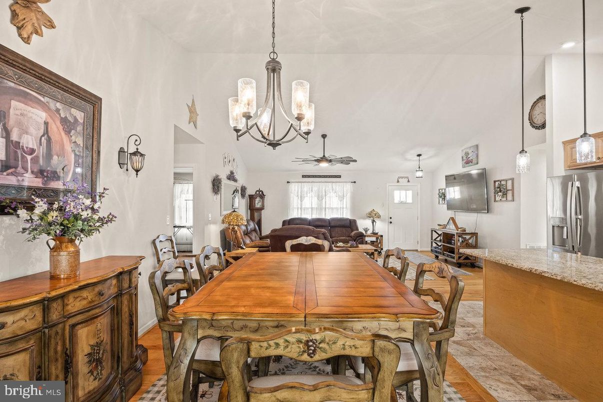 Chandelier, Dining room, Interior, Kitchen, Living room, Pendant Lights, Stainless Steel Appliances, Wood Texture Flooring