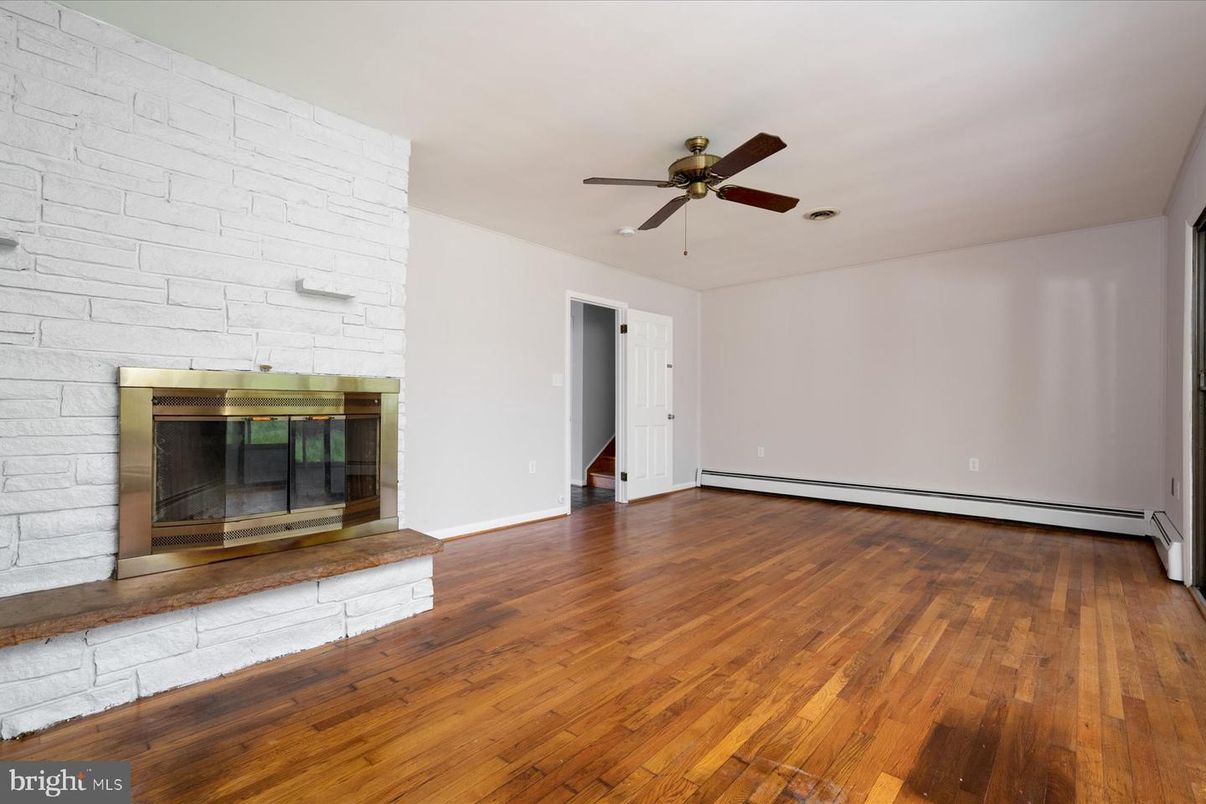 Empty room, Fireplace, Interior, Stone Walls, Wood Texture Flooring