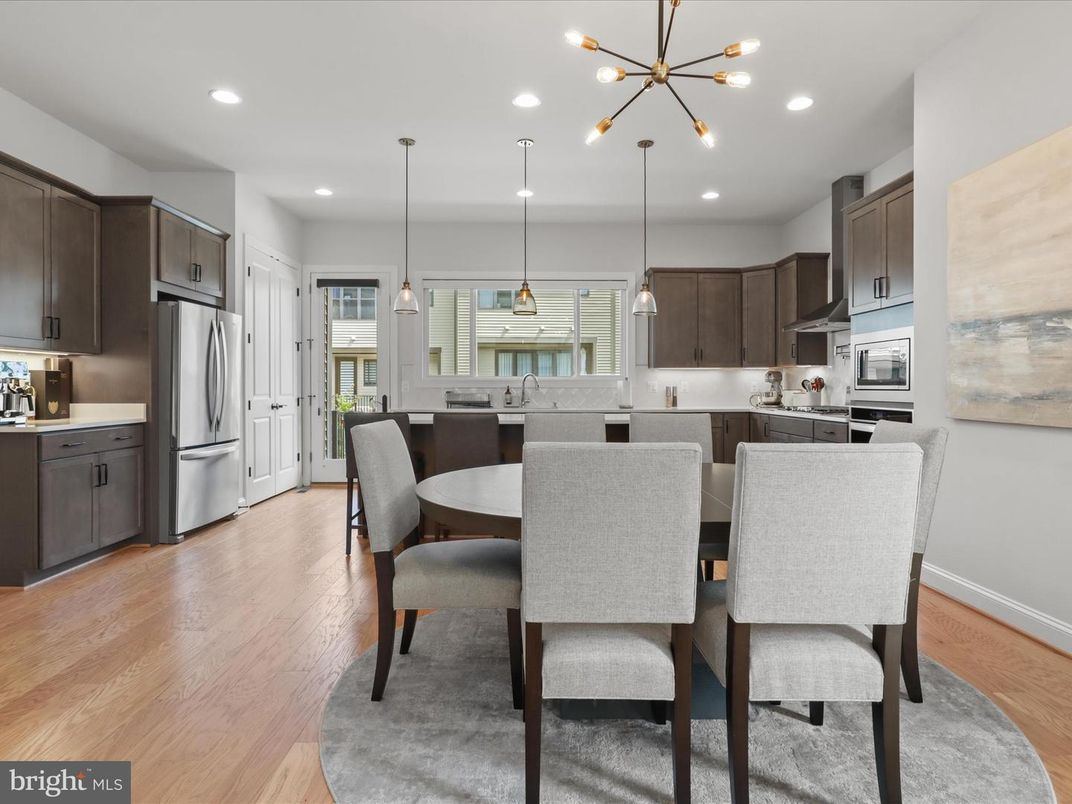 Dining room, Interior, Kitchen, Pendant Lights, Recessed Lighting, Stainless Steel Appliances, Wood Texture Flooring