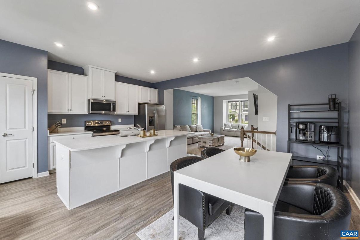 Dining room, Interior, Kitchen, Living room, Recessed Lighting, Stainless Steel Appliances, Wood Texture Flooring