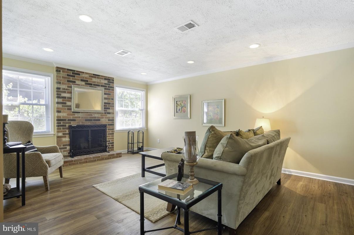 Fireplace, Interior, Living room, Recessed Lighting, Stone Walls, Wood Texture Flooring