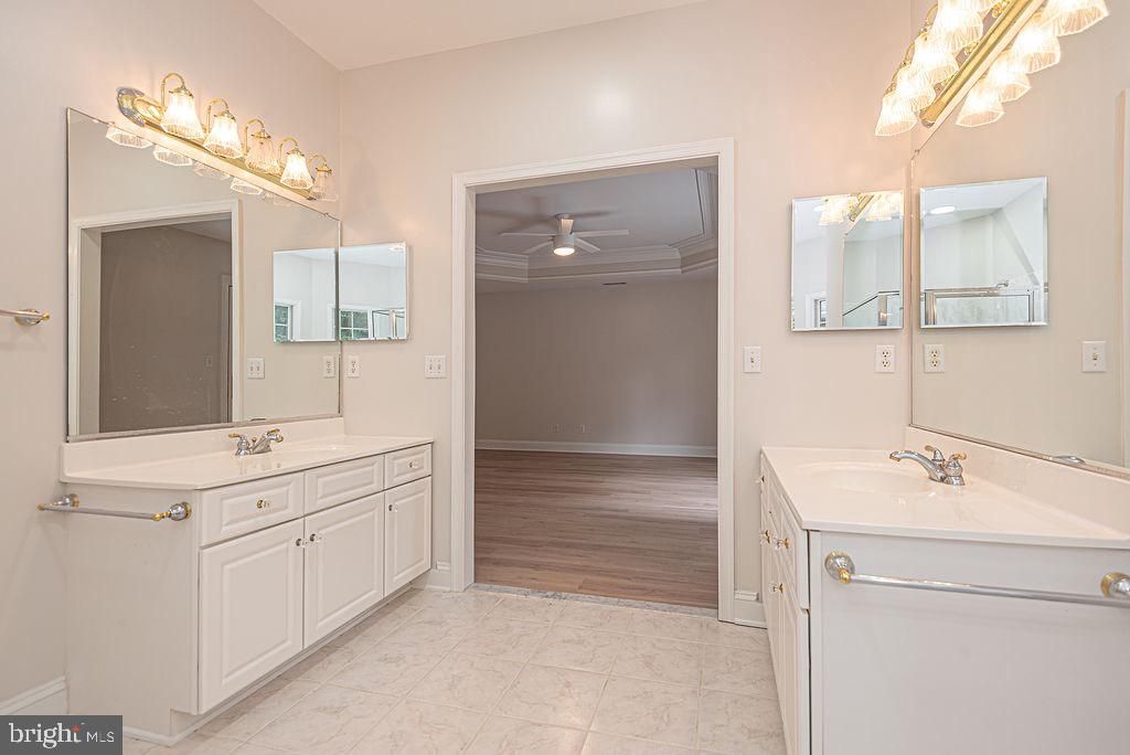 Bathroom, Dual Sink Vanities, Interior, Marble, Recessed Lighting, Wood Texture Flooring