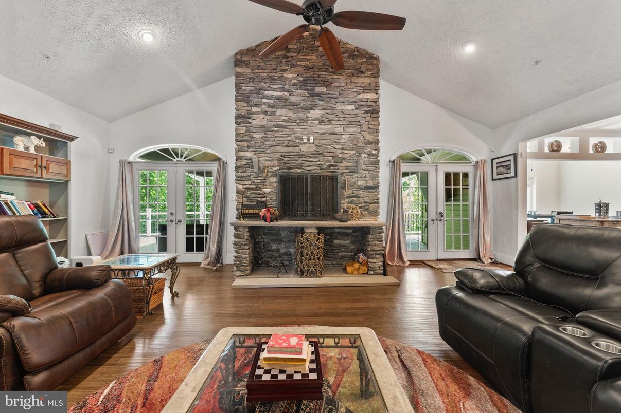 Fireplace, Interior, Living room, Recessed Lighting, Stone Walls, Wood Texture Flooring