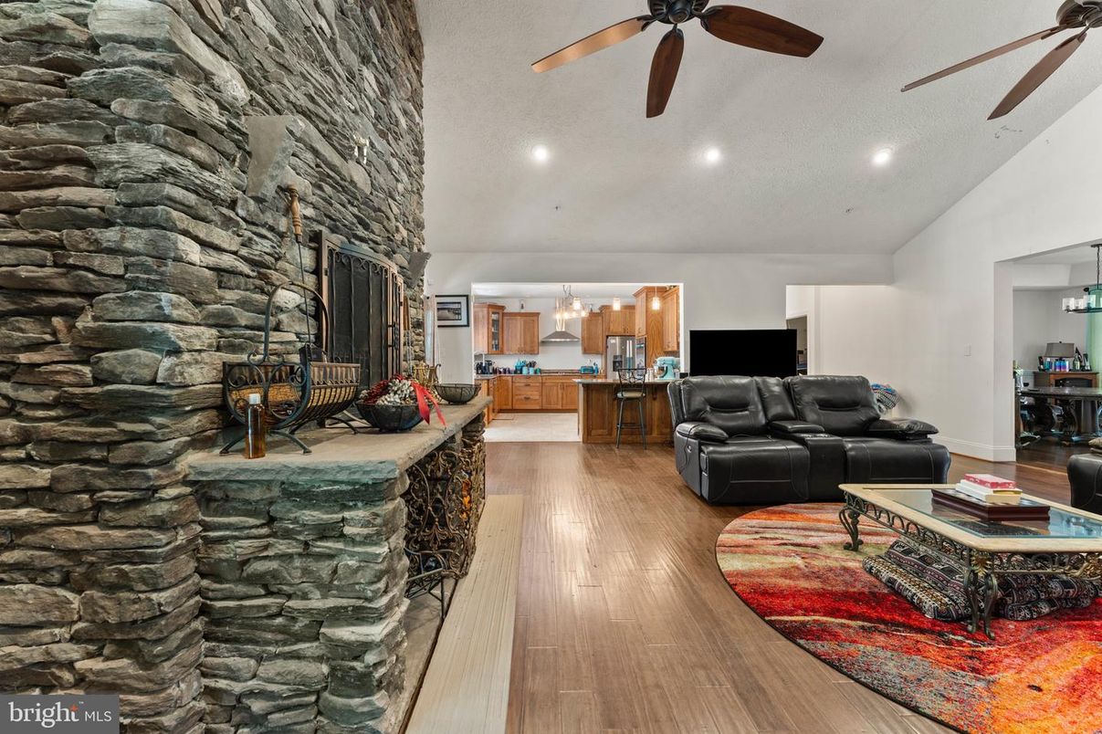 Fireplace, Interior, Living room, Pendant Lights, Recessed Lighting, Stone Walls, Wood Texture Flooring