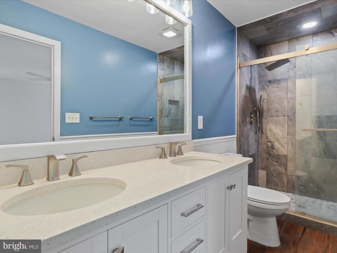 Bathroom, Dual Sink Vanities, Glass Shower, Interior, Recessed Lighting, Wood Texture Flooring