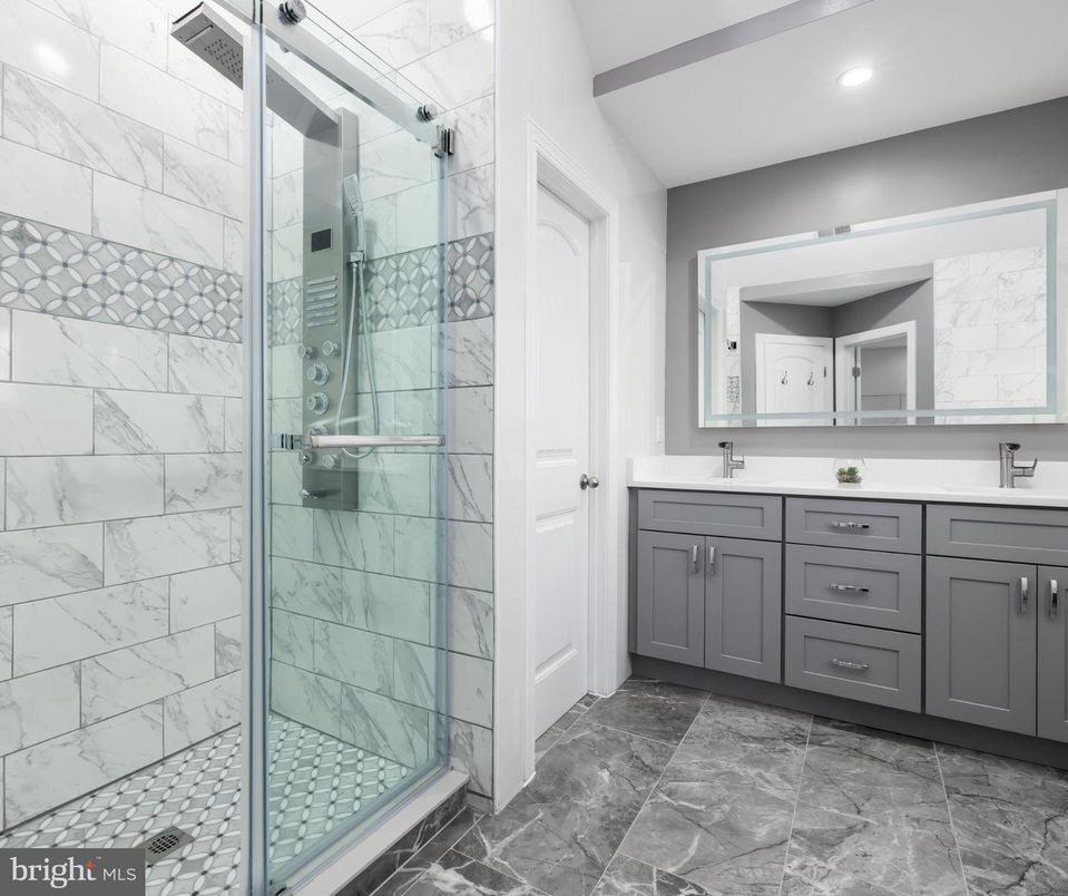Bathroom, Dual Sink Vanities, Glass Shower, Interior, Marble Walls, Recessed Lighting