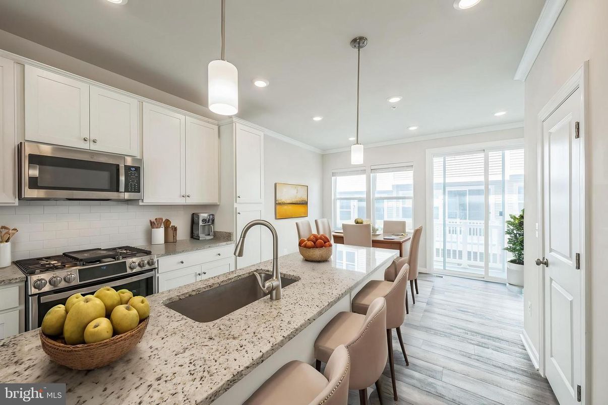 Dining room, Interior, Kitchen, Pendant Lights, Recessed Lighting, Stainless Steel Appliances, Wood Texture Flooring