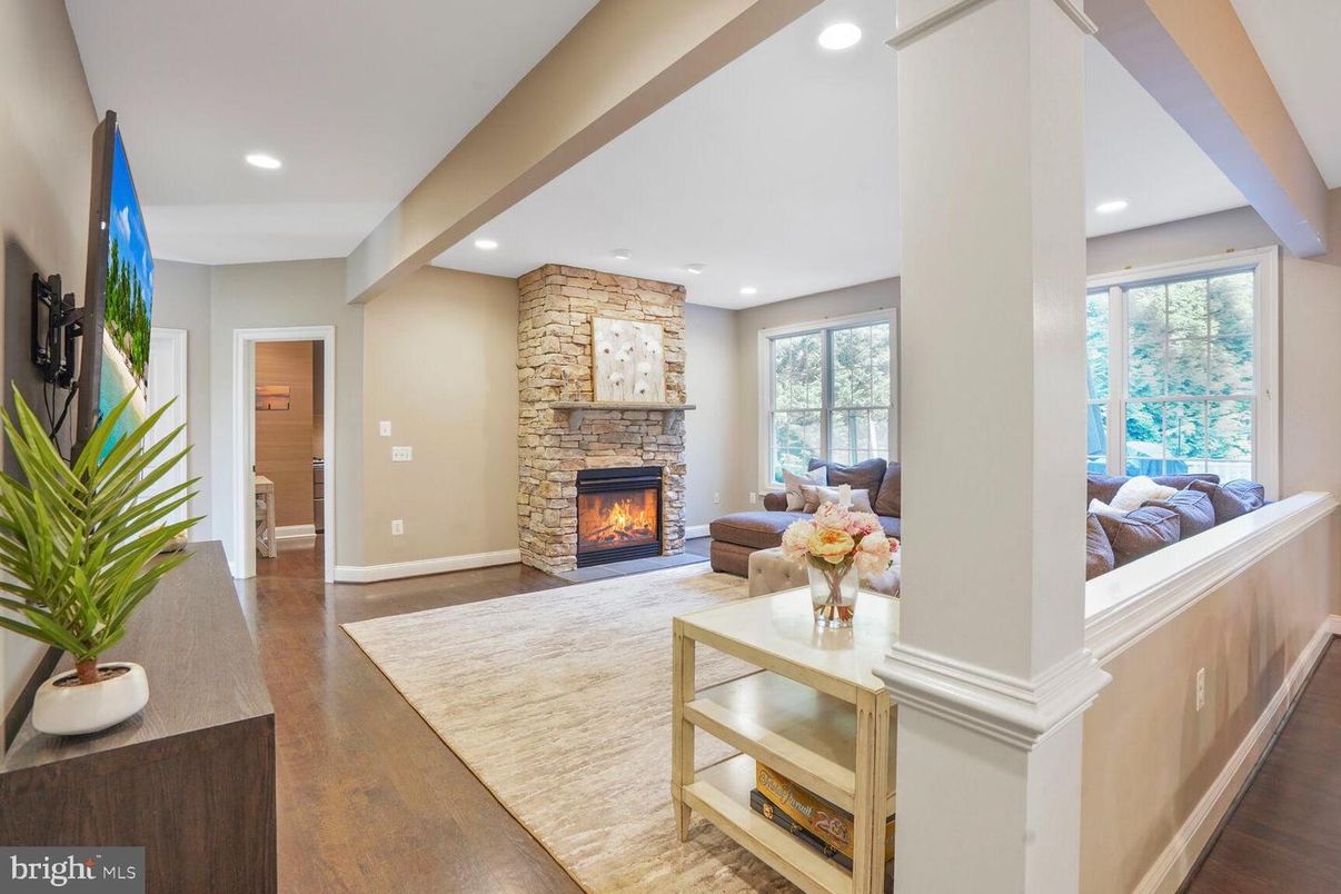 Fireplace, Interior, Living room, Recessed Lighting, Stone Walls, Wood Texture Flooring