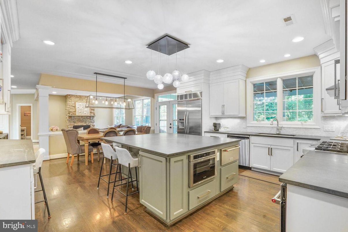 Dining room, Fireplace, Interior, Kitchen, Pendant Lights, Recessed Lighting, Stainless Steel Appliances, Wood Texture Flooring