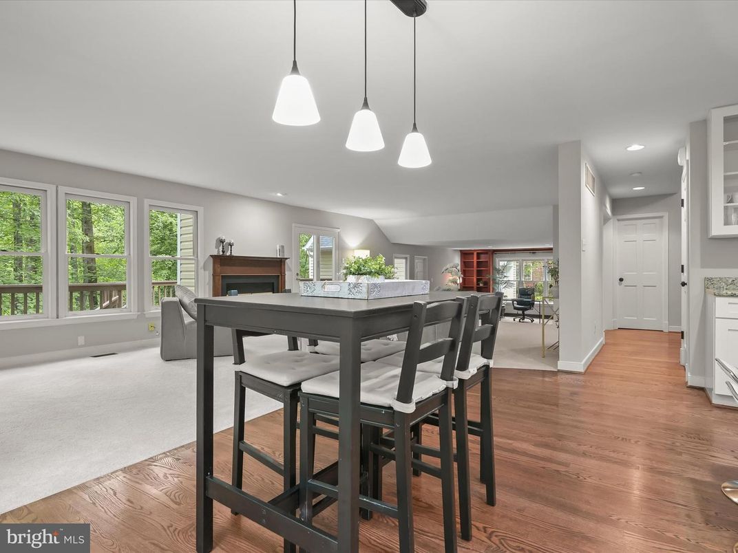 Dining room, Fireplace, Interior, Pendant Lights, Recessed Lighting, Wood Texture Flooring
