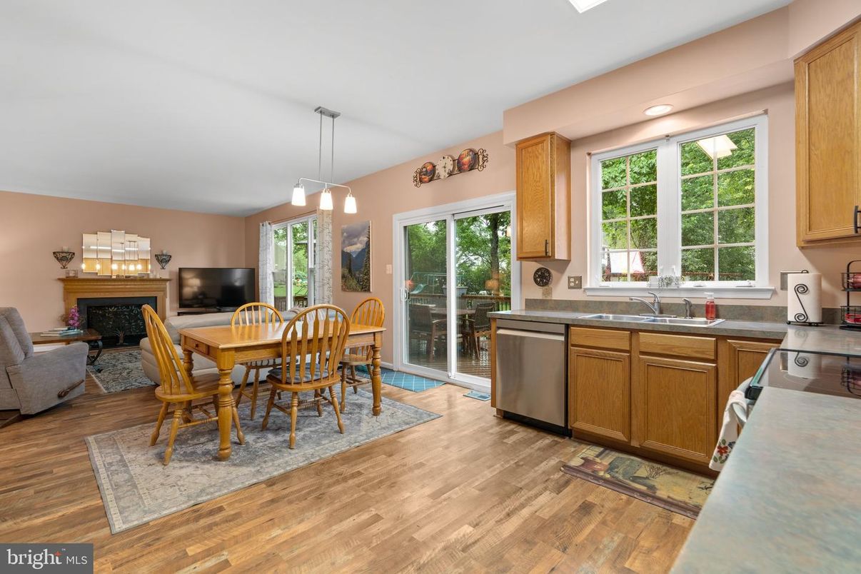 Dining room, Fireplace, Interior, Kitchen, Pendant Lights, Recessed Lighting, Wood Texture Flooring