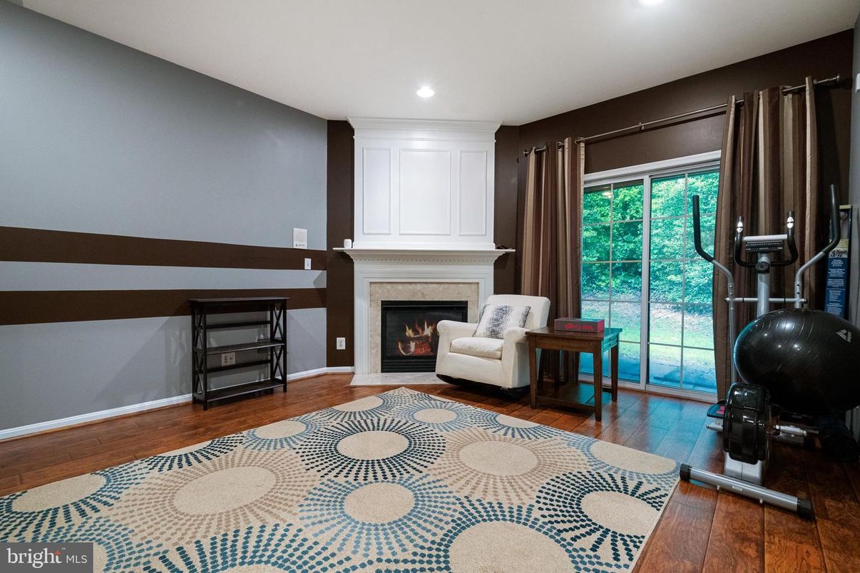Fireplace, Fitness Equipment, Interior, Recessed Lighting, Wood Texture Flooring
