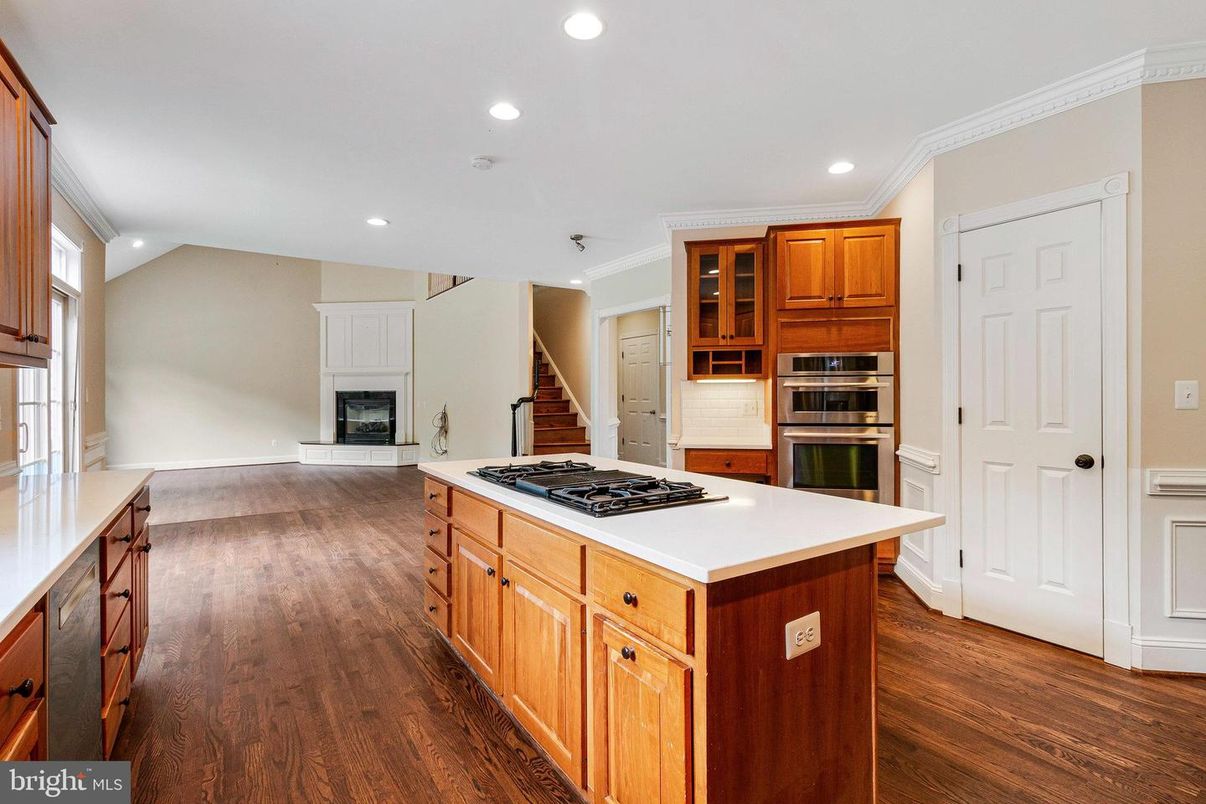 Fireplace, Interior, Kitchen, Recessed Lighting, Stainless Steel Appliances, Wood Texture Flooring