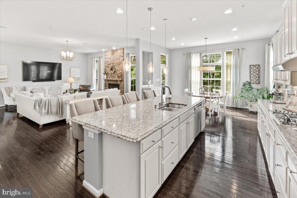 Chandelier, Dining room, Fireplace, Interior, Kitchen, Living room, Pendant Lights, Recessed Lighting, Wood Texture Flooring