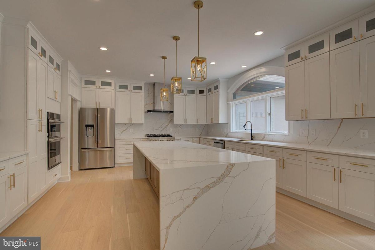 Interior, Kitchen, Marble Walls, Pendant Lights, Recessed Lighting, Stainless Steel Appliances, Wood Texture Flooring