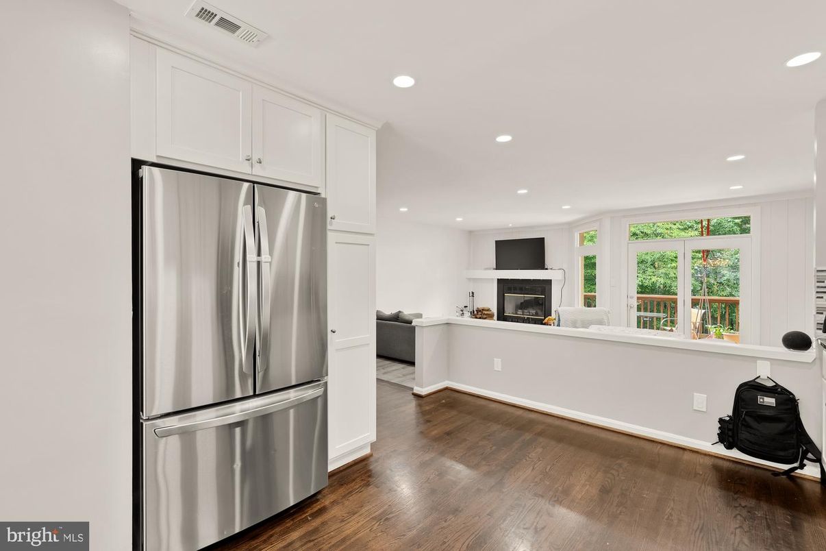 Fireplace, Interior, Kitchen, Recessed Lighting, Stainless Steel Appliances, Wood Texture Flooring