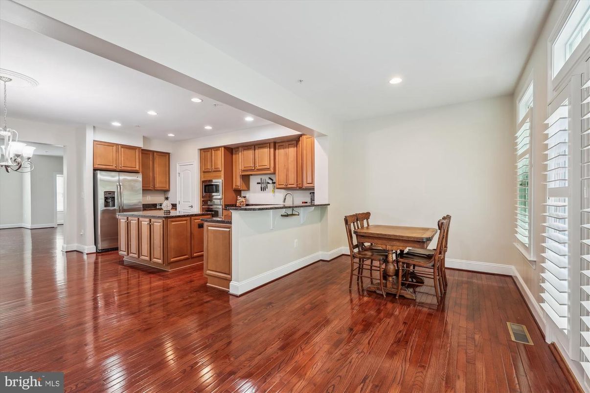 Chandelier, Dining room, Interior, Kitchen, Pendant Lights, Recessed Lighting, Stainless Steel Appliances, Wood Texture Flooring