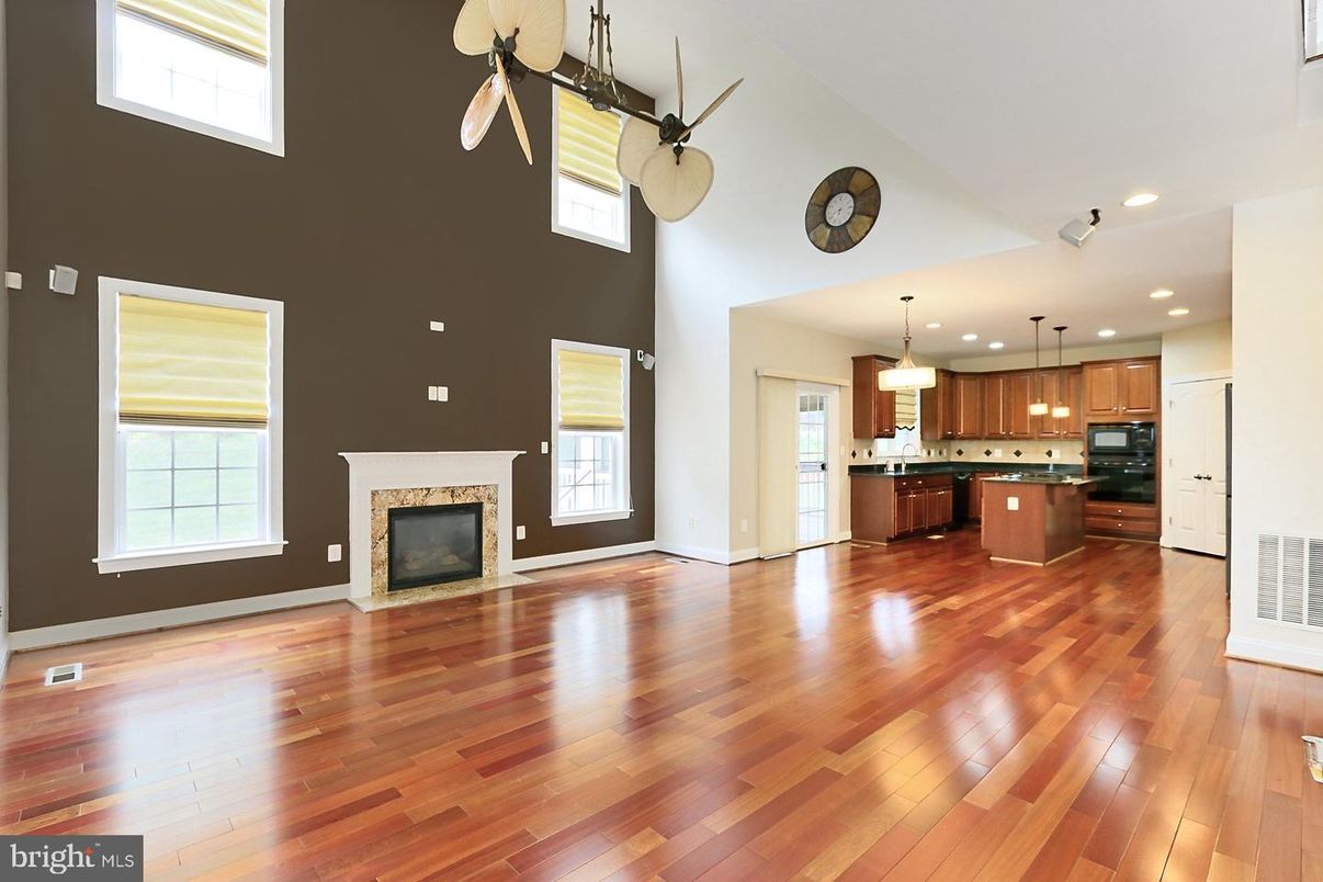 Empty room, Fireplace, Interior, Kitchen, Pendant Lights, Recessed Lighting, Wood Texture Flooring