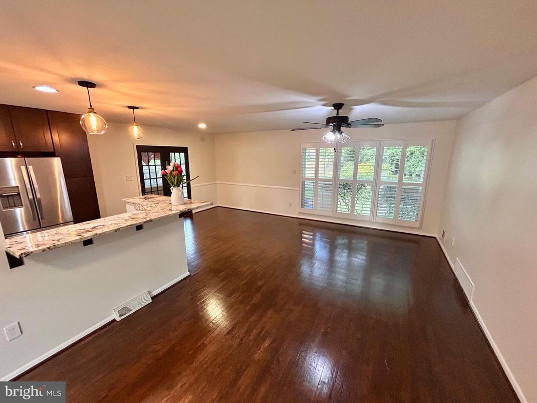 Empty room, Interior, Kitchen, Pendant Lights, Recessed Lighting, Stainless Steel Appliances, Wood Texture Flooring