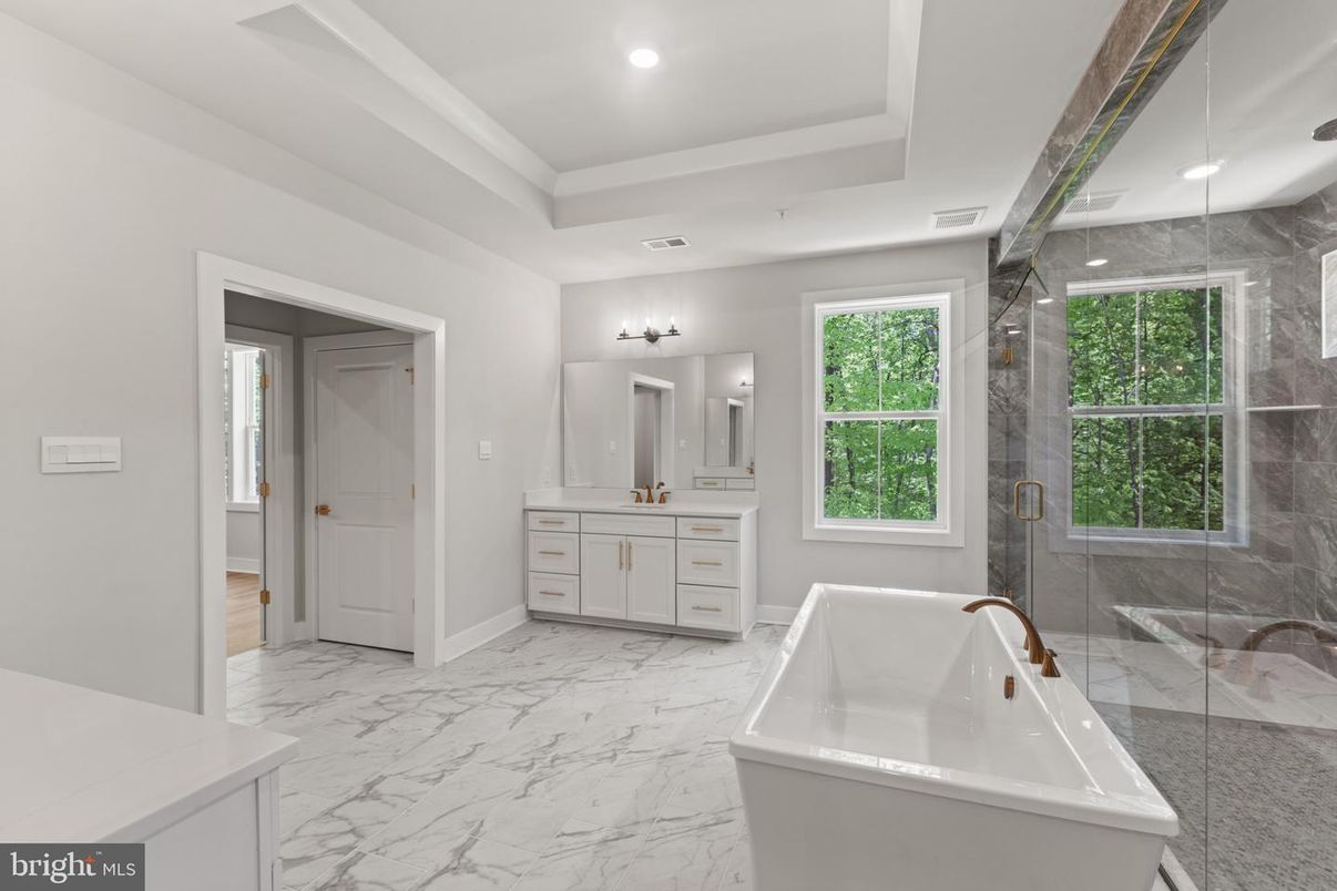 Bathroom, Dual Sink Vanities, Free Standing Baths, Glass Shower, Interior, Marble, Marble Walls, Recessed Lighting