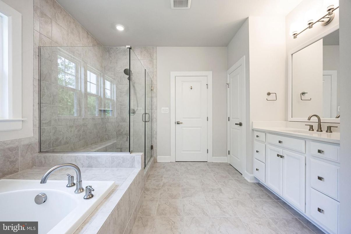 Bathroom, Dual Sink Vanities, Glass Shower, Interior, Marble, Marble Walls, Recessed Lighting