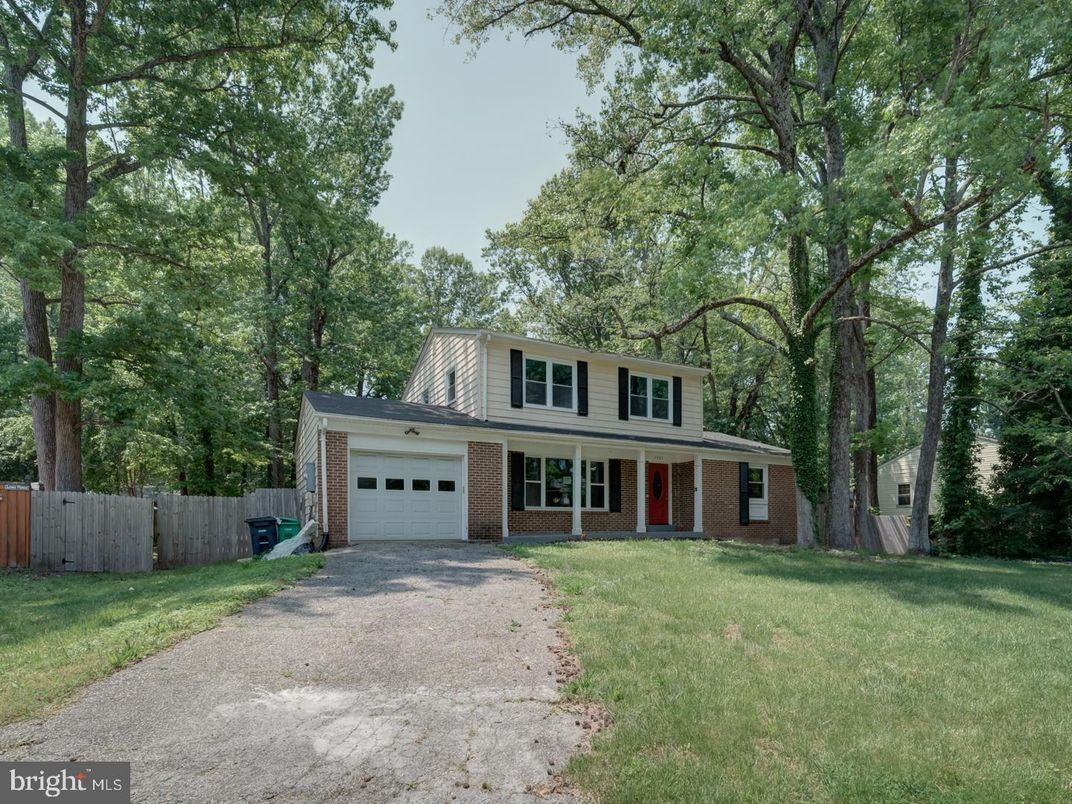 Attached, Backyard, Exterior, Facade, Brick Facade, Raised Ranch