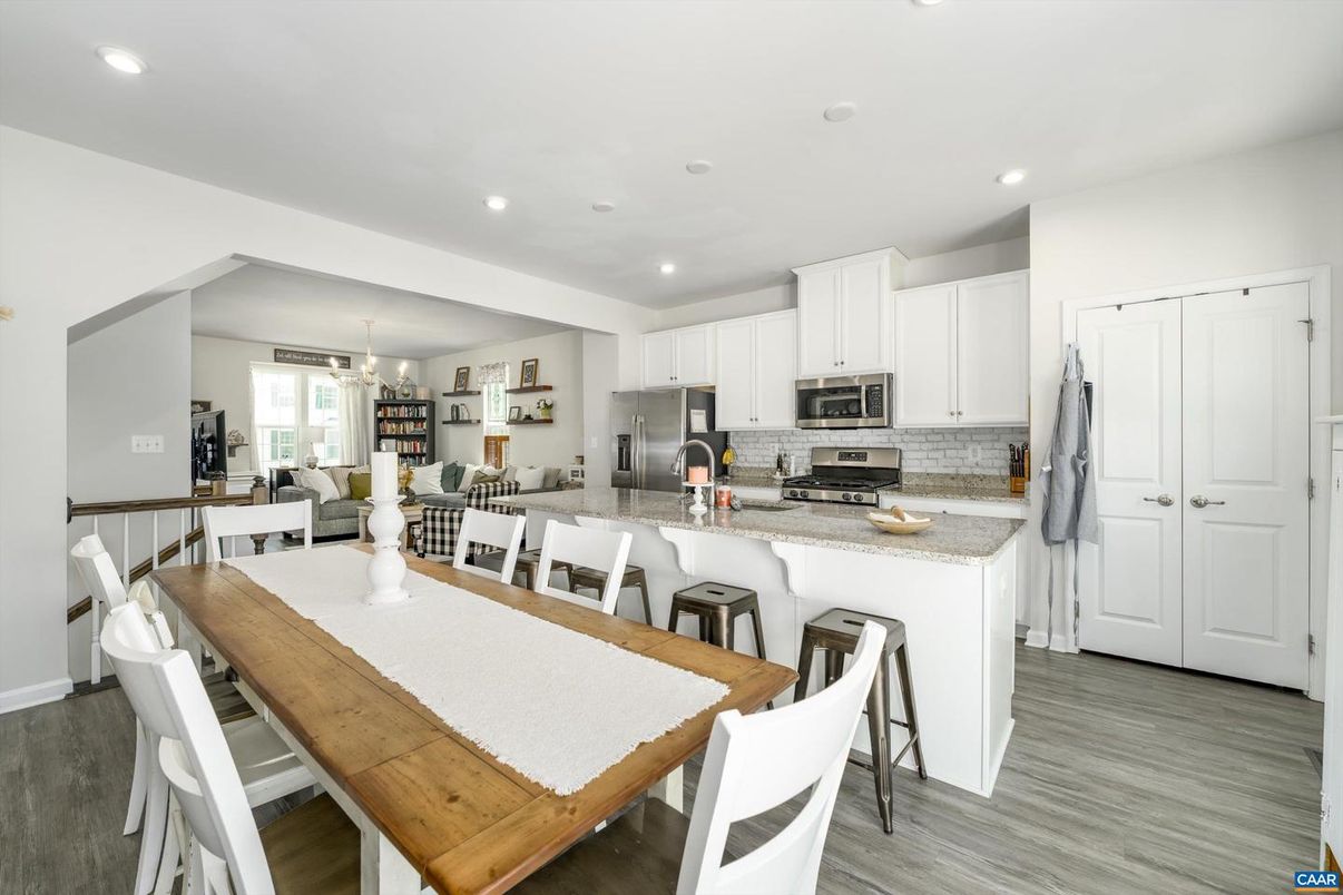 Chandelier, Dining room, Interior, Kitchen, Recessed Lighting, Stainless Steel Appliances, Wood Texture Flooring