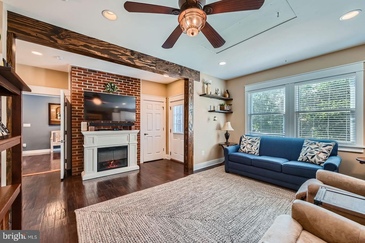 Fireplace, Interior, Living room, Recessed Lighting, Stone Walls, Wood Texture Flooring
