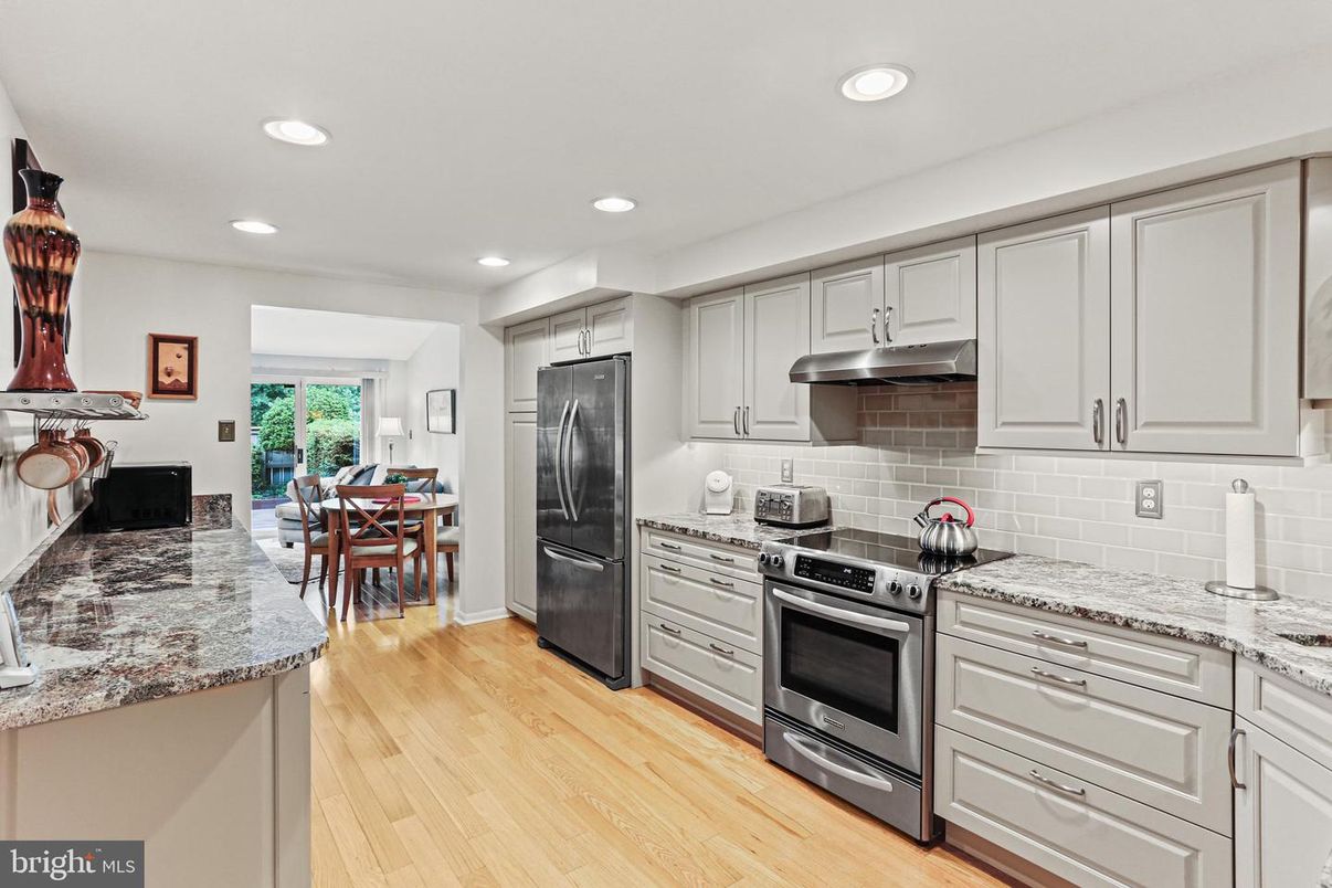 Dining room, Interior, Kitchen, Recessed Lighting, Stainless Steel Appliances, Wood Texture Flooring