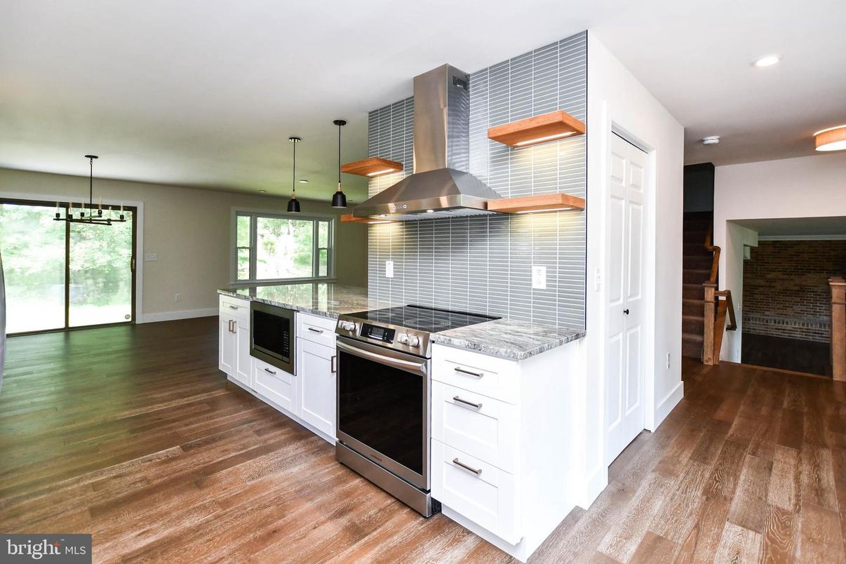 Interior, Kitchen, Pendant Lights, Recessed Lighting, Stainless Steel Appliances, Stone Walls, Wood Texture Flooring