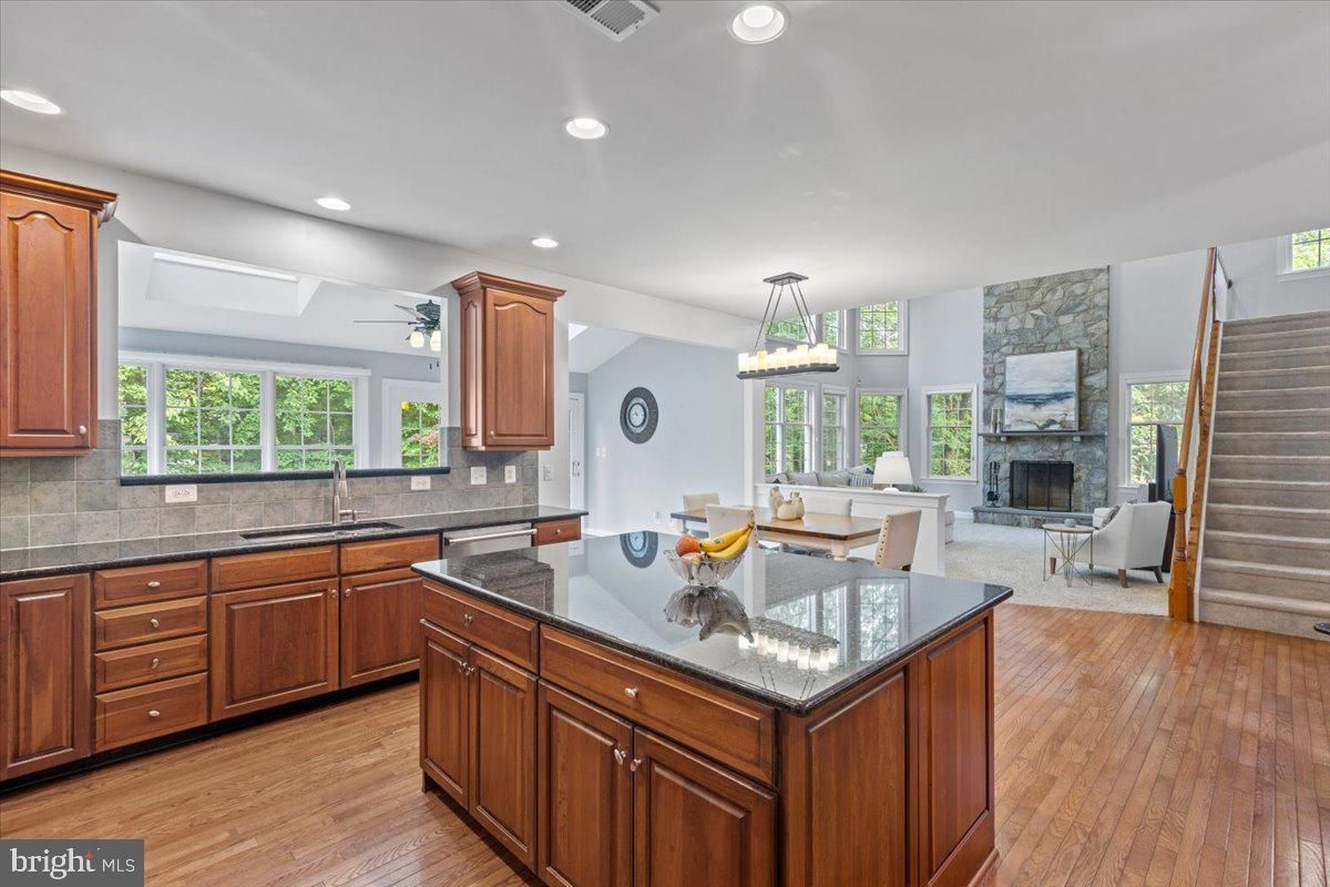 Dining room, Fireplace, Interior, Kitchen, Living room, Pendant Lights, Recessed Lighting, Stone Walls, Wood Texture Flooring