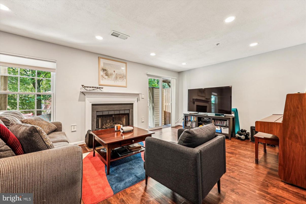 Fireplace, Interior, Living room, Piano, Recessed Lighting, Wood Texture Flooring