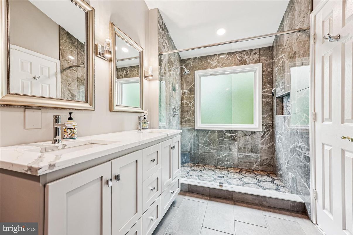 Bathroom, Dual Sink Vanities, Glass Shower, Interior, Marble Walls, Recessed Lighting