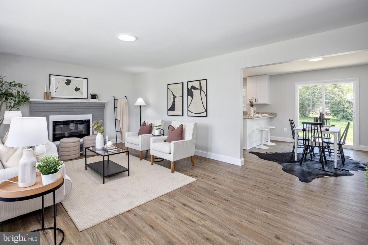 Dining room, Fireplace, Interior, Living room, Recessed Lighting, Wood Texture Flooring