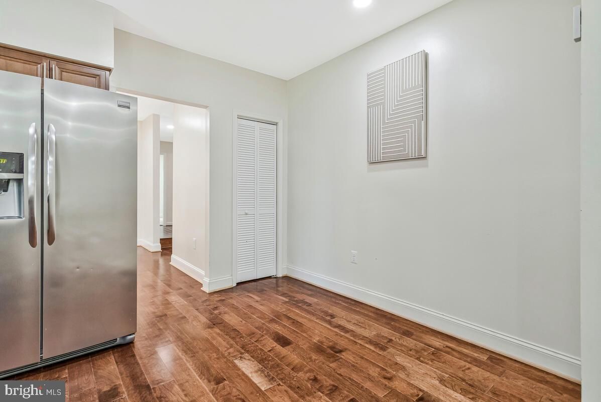 Empty room, Interior, Kitchen, Recessed Lighting, Stainless Steel Appliances, Wood Texture Flooring