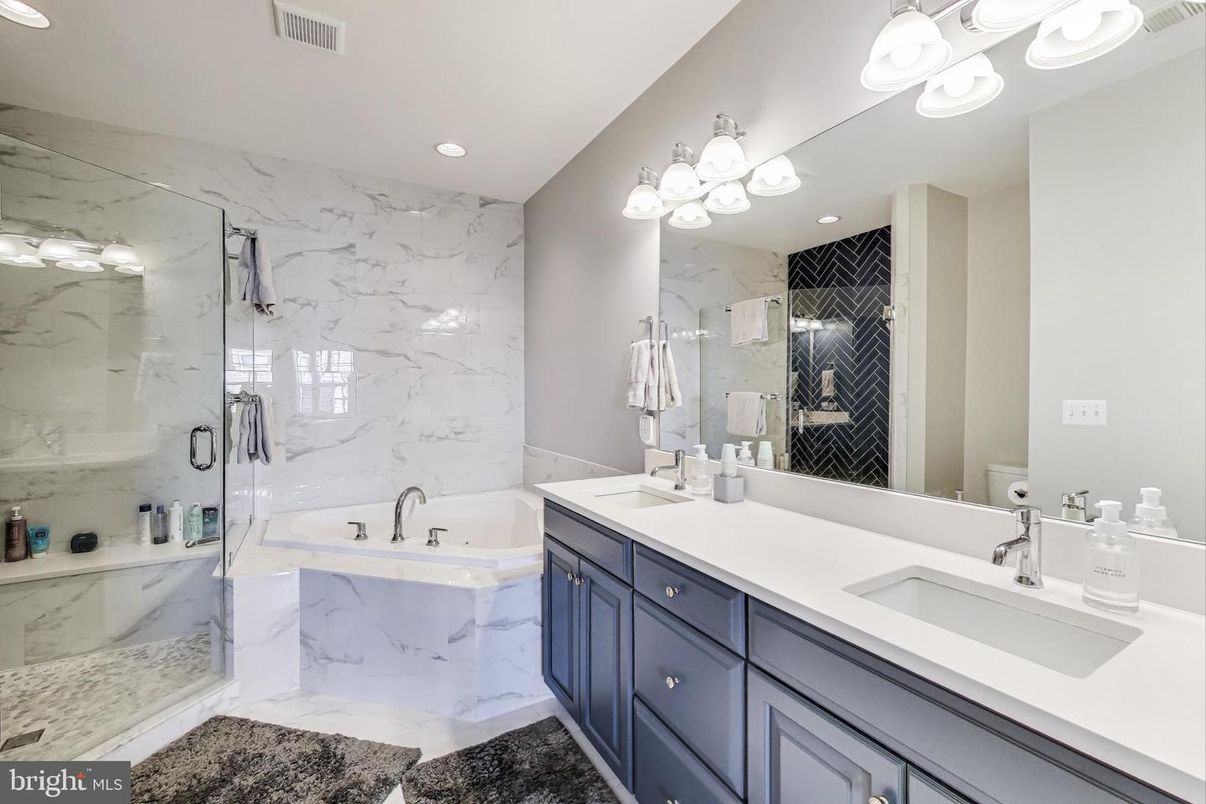 Bathroom, Dual Sink Vanities, Glass Shower, Interior, Marble, Marble Walls, Recessed Lighting