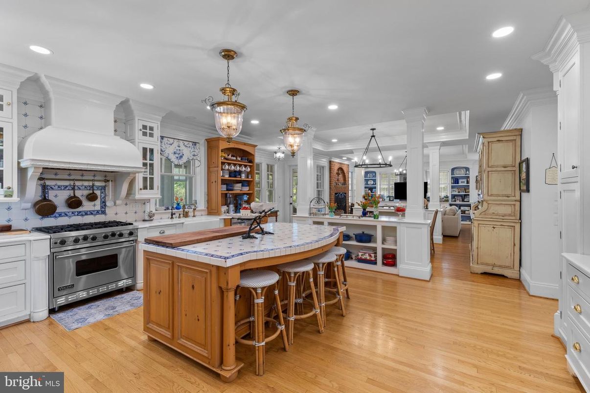 Interior, Kitchen, Pendant Lights, Recessed Lighting, Stainless Steel Appliances, Tile Countertops, Wood Texture Flooring