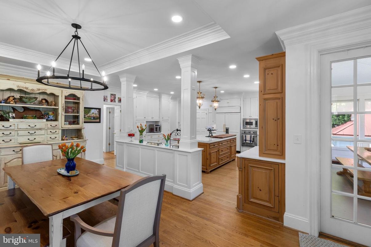 Chandelier, Dining room, Interior, Kitchen, Pendant Lights, Recessed Lighting, Stainless Steel Appliances, Wood Texture Flooring